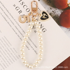 Ốp điện thoại TPU cao cấp đính đá pha lê sang trọng dành cho iPhone 16 15 11 Pro Max, kèm dây đeo tay chuỗi ngọc trai đơn giản, mẫu mới - Product Image 6