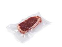 Machine d'emballage par thermoformage automatique sous vide pour la transformation de viandes de charcuterie