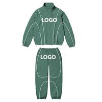 Ensemble de survêtement coupe-vent personnalisé en nylon pour homme : veste de sport zippée et pantalon coupe-vent pour l'entraînement