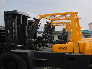 Multi High Quality <b>Used</b> 10 Ton Diesel TCM FD100Z8 Forklift with 4WD Solid Tire Rough Terrain Capability - Product Image 3