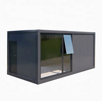 Maison conteneur préfabriquée modulaire en acier de 20 pieds avec mur rideau en verre pour bureau, studio, jardin, extérieur