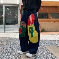 Pantalon en jean style américain rétro, design color-block, imprimé patchwork, coupe ample et large, pour hommes et femmes, nouveau style