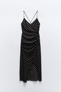 Vestido de lunares negros con clase, perfecto para ocasiones casuales y formales, disponible a granel - Product Image 4