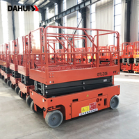 Plateforme élévatrice à ciseaux autopropulsée hydraulique durable avec batterie à longue autonomie et garde-corps pliables
