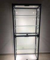 Vitrine de présentation de bijoux moderne personnalisée avec éclairage LED, miroir, porte coulissante en verre pour magasin de détail