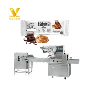 Machine d'emballage multifonctionnelle pour objets réguliers machine d'emballage de barres protéinées chocolatées à flux de type oreiller