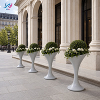 Vase en fibre de verre YMJ de forme irrégulière sculptée avec effet de surface en ciment, design moderne durable, personnalisable