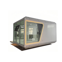 Maison conteneur modulaire en acier pliable moderne, type Apple Cabin, utilisable comme hôtel, entrepôt, bureau ou logement.