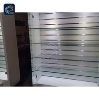 Vitrine d'exposition personnalisée pour téléphones portables avec panneau arrière, logo de marque, port de charge, étagère en verre et fixation sécurisée à verrouillage