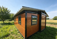 Maison conteneur préfabriquée de luxe moderne extensible et isolée, avec cuisine, salon, chambre et bureau intégrés