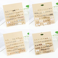Ensemble de boucles d'oreilles tendance, design fleur, étoile de mer, papillon, en alliage, clous et pendantes, pour femmes, bijoux de luxe léger, vente en gros