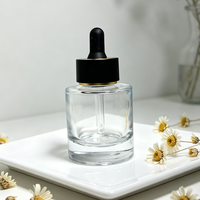Système compte-gouttes en verre premium 30 ml avec capuchon noir mat et emballage carton pour crème visage et collyre