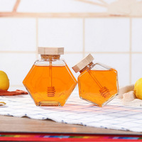 Tarro de miel único con cucharón de madera Tarro de vidrio hexagonal al por mayor para miel