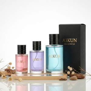 Aikun - Juego de Perfume Recargable en Frasco de Vidrio Transparente con Tapa Negra y Líquido de Colores, para Viajes, Venta al por Mayor, Caja de Regalo - Product Image 1
