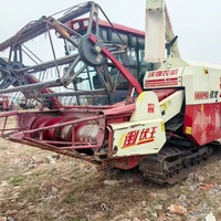 Moissonneuse-batteuse multifonctionnelle WORLD d'occasion en bon état, machine de récolte de riz sur chenilles d'occasion, économe en énergie