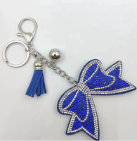 Koningsblauwe modieuze strikvormige sleutelhanger met volledig bezette strass steentjes en kwastjes, hoogwaardig, best verkochte charme hangende ornament