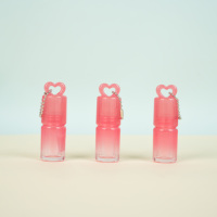 Caractéristiques uniques Tubes de brillant à lèvres vides roses Tube de brillant à lèvres mignon rond Bouteille de rouge à lèvres 3ml avec porte-clés