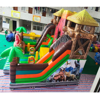 Structure gonflable à thème volcan dinosaure avec toboggan, combo de jeux gonflables pour enfants, idéal pour les fêtes en plein air et les aires de jeux.