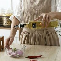 Bouteilles d'huile d'olive en verre transparent de qualité supérieure avec bouchon compte-gouttes pour l'emballage alimentaire gastronomique en gros