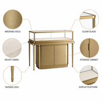Vitrine à bijoux moderne en métal doré avec éclairage LED et rangement dissimulé pour les magasins de bijoux en gros