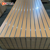 Panneau MDF mélaminé brut E1 de première qualité, rainuré, moderne, résistant à l'humidité, pour l'emballage de meubles