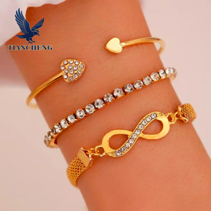 طقم أساور نسائية مكون من 3 قطع مطلية بالذهب مع زركون على شكل رقم 8 قابل للتعديل - Product Image 1