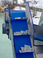 Machine automatique de tri et d'agencement pour produits en bâtonnets