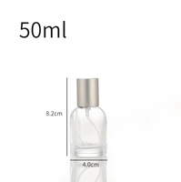 Venta al por mayor directa de fábrica: Botella de perfume redonda de vidrio transparente de 30ml, 50ml, 100ml con tapa y serigrafía para esmalte de uñas/aceite.