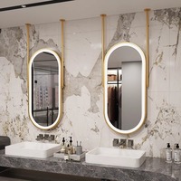 Miroir ovale suspendu intelligent à LED avec cadre en métal et fer, finition noir et or, design moderne d'Europe du Nord pour hôtel et maison
