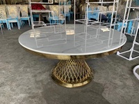 Table à manger ronde avec base en acier inoxydable et dessus en marbre pour les mariages