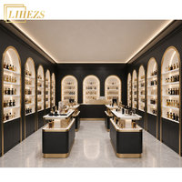Mobilier de décoration personnalisé noir et or lumineux, robuste et cintrée, pour boutique de parfums de style arabe, idéal pour showroom de Dubaï