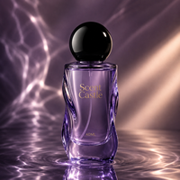 Flacon de parfum rond de luxe de 40 ml, nouveau design, emballage en verre avec pompe à pression et bouchon rond.