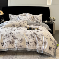 Parure de lit 4 pièces en fibre de polyester 100 % lavée effet soie, motif floral papillon, avec bordure large contrastante, housse de couette et draps en satin romantique