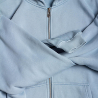 Ensemble jogging homme personnalisé 2 pièces : sweat à capuche zippé oversize et pantalon de survêtement large bleu clair uni, style streetwear décontracté