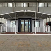 Bâtiment conteneur modulaire extensible à ailes latérales avec intérieur ouvert, cabine mobile pour bureau de chantier, garage et personnel
