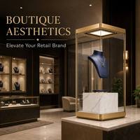Vitrine d'exposition de bijoux en métal doré sur mesure avec base en marbre et éclairage LED pour montres et pierres précieuses