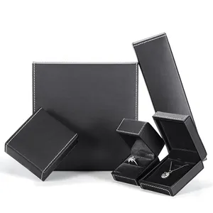 Yüksek kaliteli kolye kutusu siyah renk dikdörtgen depolama beyaz dikiş özel logo PU deri takı ambalaj kutusu
