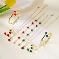 Ensemble de bijoux cinq pièces motif fleur trèfle à cinq feuilles, plaqué or, collier, bracelet, boucles d'oreilles, bijoux fantaisie pour femme, argent et noir, transfrontalier
