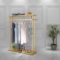 Étagère de présentation pour magasin de vêtements, design neuf, en acier inoxydable brillant doré, avec base.