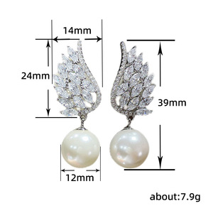 Boucles d'oreilles élégantes en forme d'aile d'ange pour femmes, avec perles et pierres scintillantes, à porter au quotidien, bijoux cadeaux, vente en gros - Product Image 5