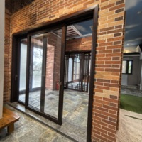 Porte coulissante en verre à faible émissivité insonorisée pour hôtel et villa de luxe Porte coulissante intérieure à économie d'énergie en bois massif pour les centres commerciaux