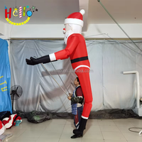 Costume de poupée gonflable géante de Père Noël, contrôlé par une tige, pour défilé de Noël