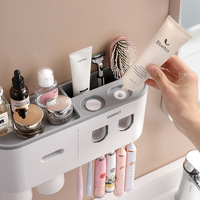 Presse-dentifrice électrique mural Porte-brosse à dents sans poinçon avec rince-bouche en plastique durable Fabricant direct