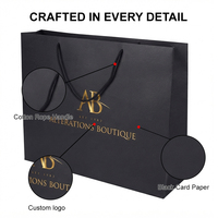 Sacs cadeaux en papier de luxe personnalisés en gros avec poignées à cordon pour les magasins de vêtements et le commerce de détail
