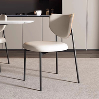 2025 nouvelle chaise de salle à manger contemporaine ancienne lumière italienne luxe moderne Simple rétro haut sens chaise en bois massif cuir + métal