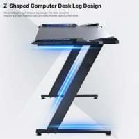 Bureau d'ordinateur en forme de Z AJUNION avec structure en acier, plateau en fibre de carbone, bureau de jeu avec éclairage LED RVB, supporte jusqu'à 200 livres