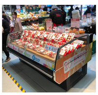 Vitrine réfrigérée incurvée pour fruits de mer avec refroidissement par air, grande capacité, unité commerciale pour les épiceries