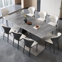 Table à manger moderne de luxe avec plateau en pierre frittée grise et base en métal géométrique pour mobilier de villa haut de gamme