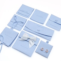 Boîte à bijoux en suède pour emballage de bijoux 2025, sac cadeau noir, boîtes d'emballage, sac à bouton pression en microfibre avec carte insérée
