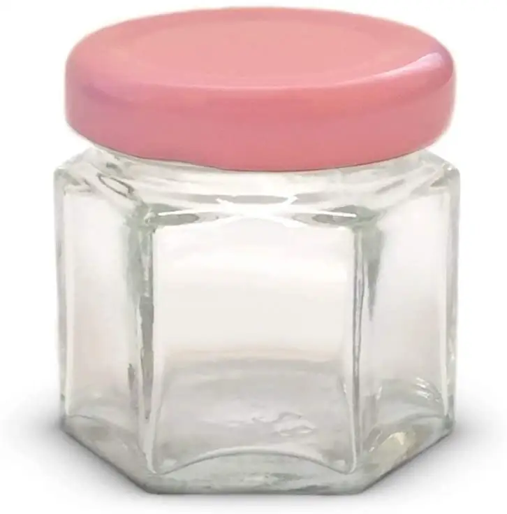 Pot de bougie cylindrique en verre blanc givré, contenant avec couvercle en métal rose